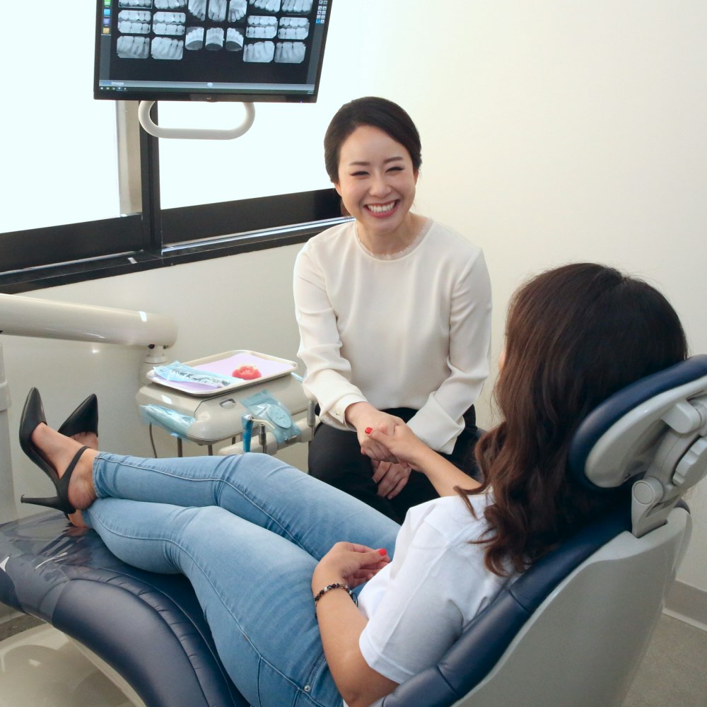 Dr. Min Hee Oh greeting a patient during a general dentistry visit in Los Angeles